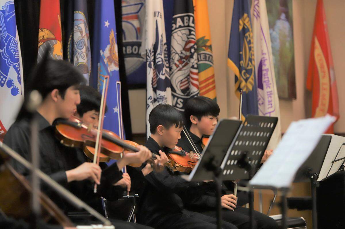 Members of We-Woori (woori in Korean means “us” or “together”), the community service youth group of the Idaho Korean Association, perform Thursday, May 1, 2025, at the Idaho State Veterans Home in Boise as part of a ceremony honoring Korean War veterans.