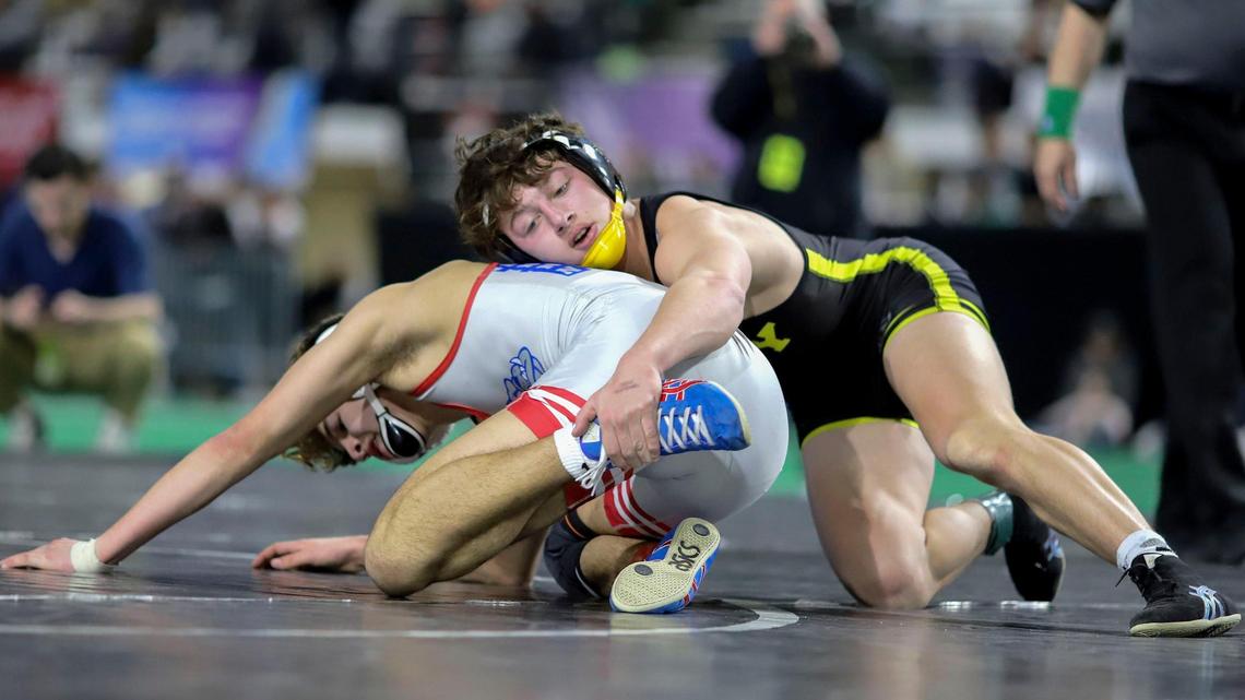Bishop Kelly senior Christopher Martino, right, won his fourth state title with a 17-6 major decision over Nampa’s Nikko Gonzalez in the 4A 132-pound state finals Saturday at Holt Arena in Pocatello.