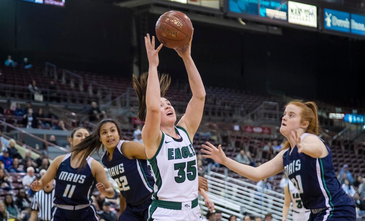 Eagle junior Alex Stokoe reaches for a pass into the paint during the Mustangs’ 5A state girls basketball tournament semifinal game against Mountain View Friday, Feb. 21, 2020 at Ford Idaho Center in Nampa.