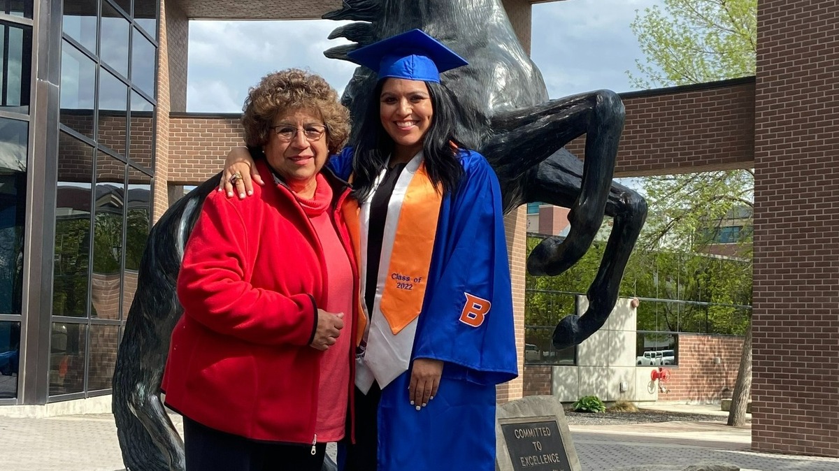 Former Boise State defensive lineman Paul Reyna’s mother, Carolyn Gusman (left), returned to Boise this week to celebrate the graduation of his sister, Ryann Gusman-Reyna. Gusman-Reyna (right) was presented with her brother’s graduation tassel during a ceremony on Friday.
