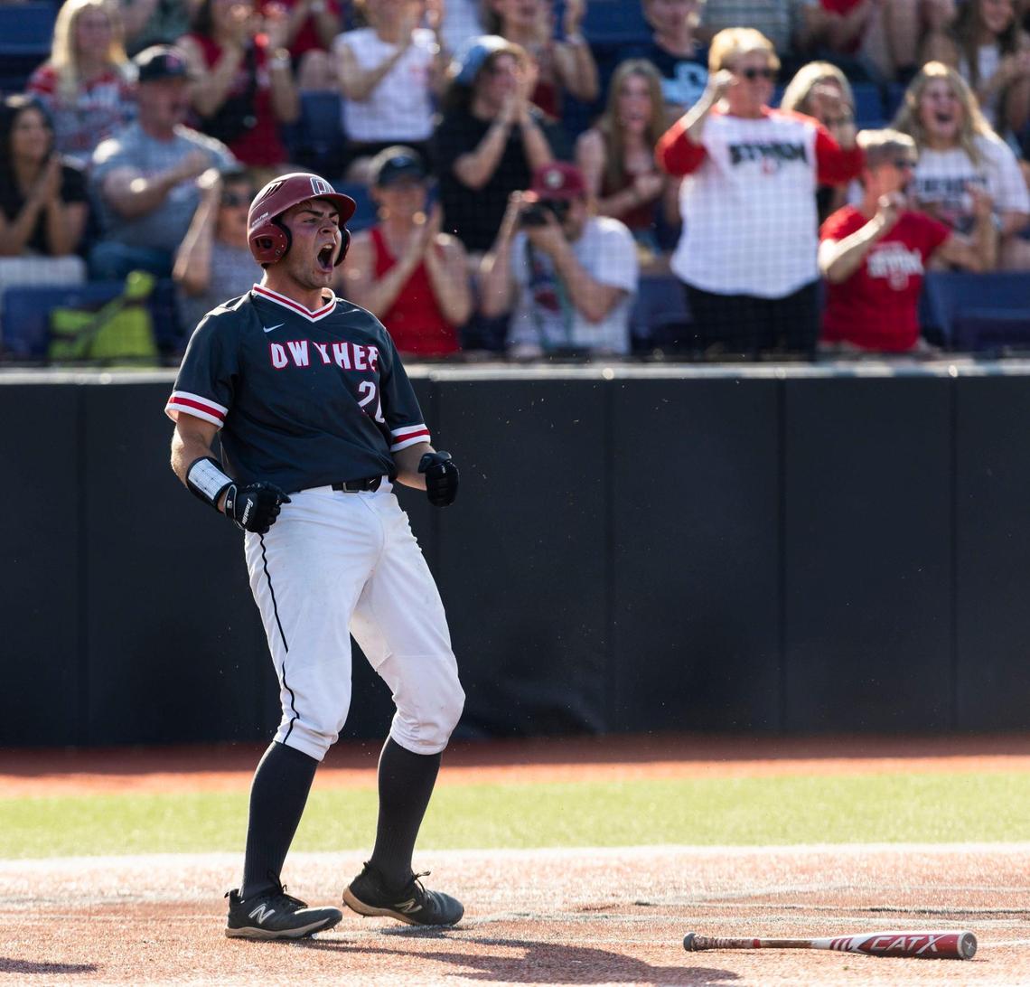 Owyhee junior Ryder Cutlip celebrates at home plate after scoring in the 5A state baseball championship.