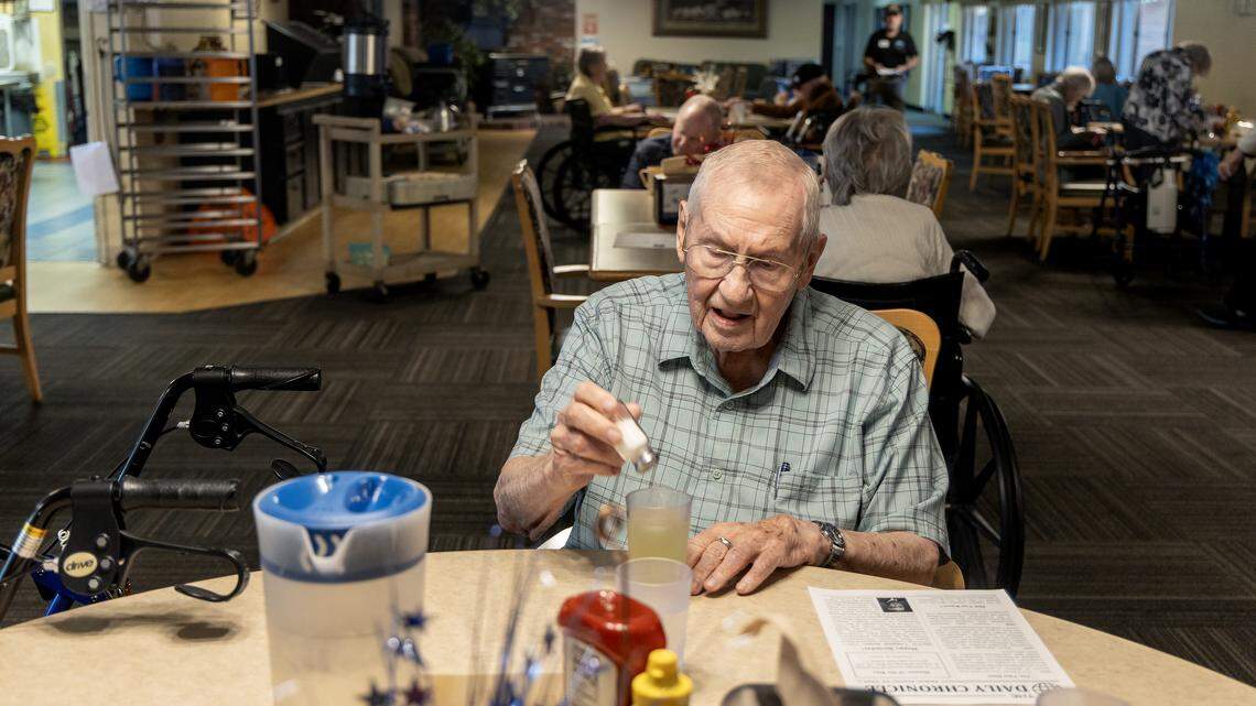 Resident Stan Fellows salts his lemonade in the cafeteria at Table Rock Senior Living At Park Place, a senior living and memory care community located in Nampa, Friday, August. 29, 2025. 