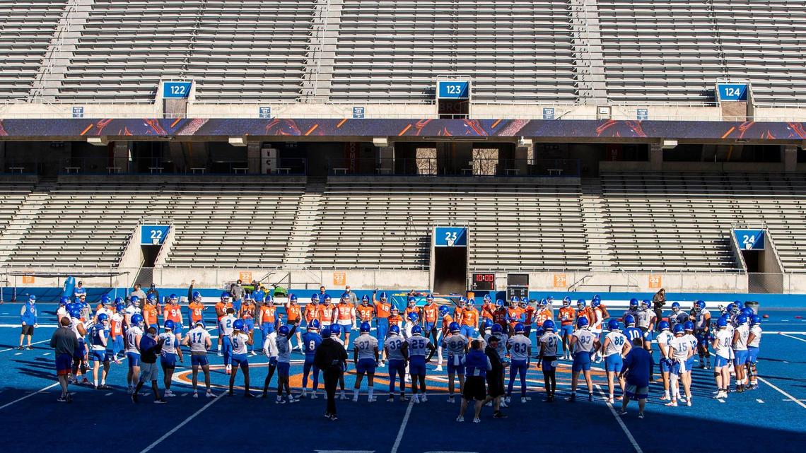 The Boise State Broncos gather on The Blue at midfield as practice begins March 12 during spring football practice at Albertsons Stadium.