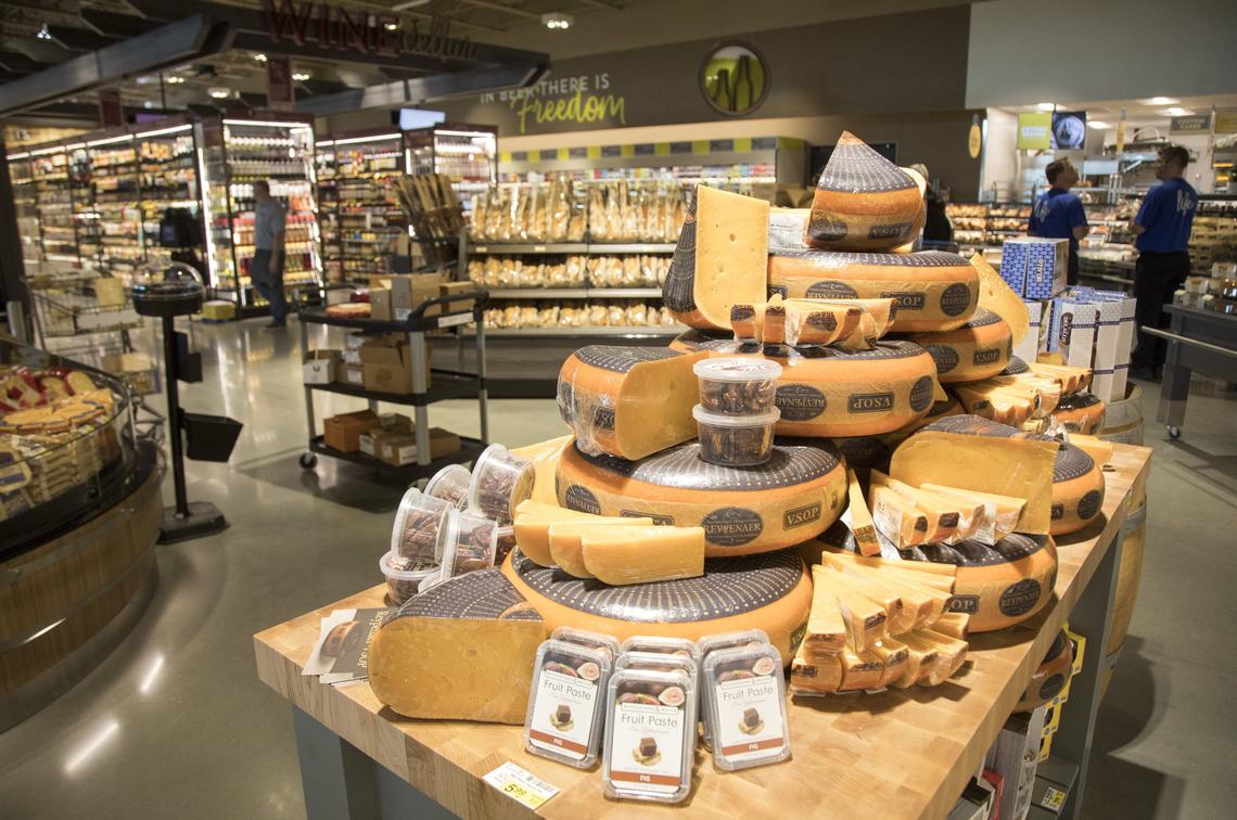 The new Albertsons on Broadway Avenue includes an expansive selection of gourmet cheeses. The store has traditional grocery jobs and others handling nontraditional tasks, such as serving pizzas from a wood-burning oven and catering.