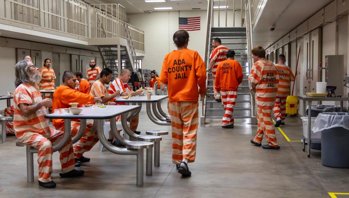 Incarcerated people eat lunch and socialize in the medium custody section of the Ada County Jail.