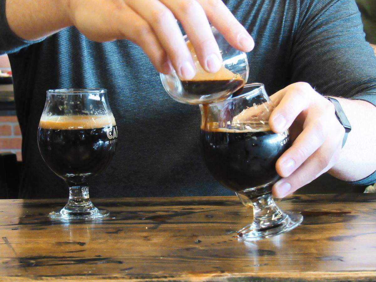 Caffenia Roasting Co. combines craft coffee and beer. Its signature beverage is Brew on Brew, a snifter of Crooked Fence porter or stout, topped off with an espresso shot ($7).