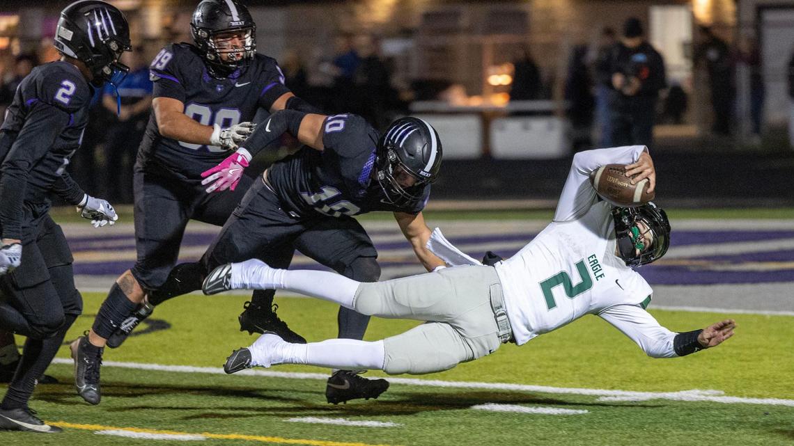 Eagle quarterback Austin Ramsey lunges forward for extra yards in the 6A SIC championship game at Rocky Mountain last year. 