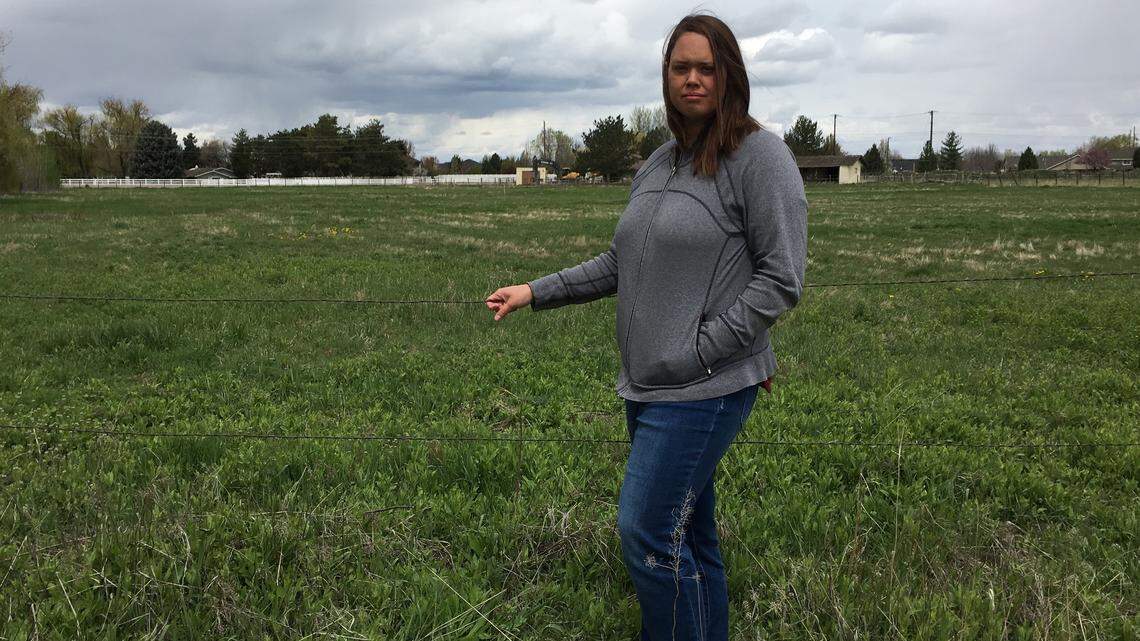 Marisa Keith, one of the main opponents of the proposed Sabana subdivision, testified Tuesday before the Boise City Council, saying the development would create more traffic and interfere with rural life. Here, she stands at the boundary of her own five acres. The empty swath of green behind her is where 11 townhouses, 11 single-family homes and three duplexes have been planned.