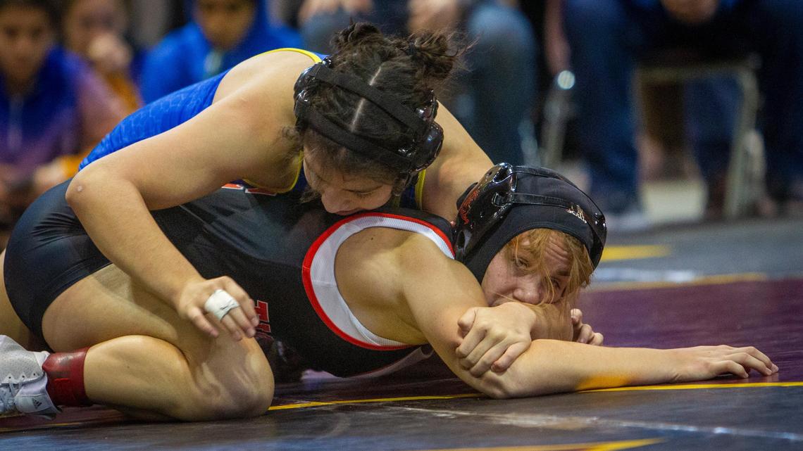 Caldwell’s Marissa Jimenez, top, beat Idaho Falls’ Brigid Shannon for the 130-pound girls championship in the Rollie Lane Invite in January. Because Caldwell has so many strong lower-weight male wrestlers, Jimenez did not qualify for the district tournament or state. Shannon qualified for the 4A state meet at 126 pounds.