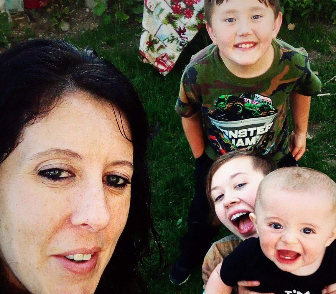 Onyx Cornish, right middle, with her mother, Crystal Thompson, and two younger brothers. Onyx, 18, was killed on Monday, and her father is the suspect.