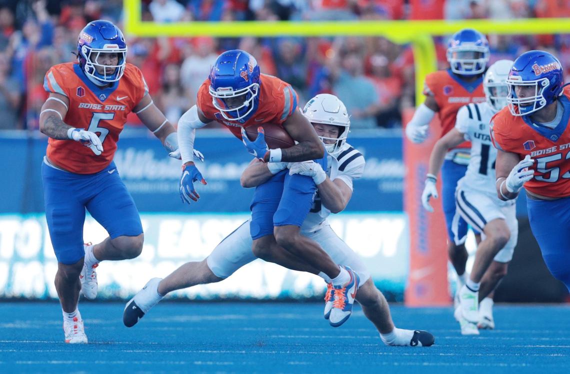 Boise State safety Ty Benefield gets taken down by Utah State tight end Will Monney after picking up a fumble. 