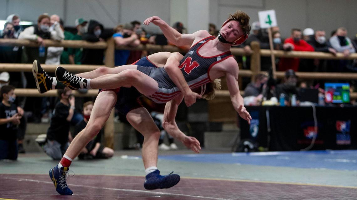 New Plymouth’s Kyle Rice, back, throws Nampa’s Peyton Munson to the mat during the Rollie Lane Wrestling Invitational 120-pound championship Saturday. Rice won the match 5-0.