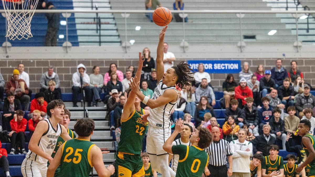 Capital’s Quincey Clay rises over the Borah defense for a two points last season. 