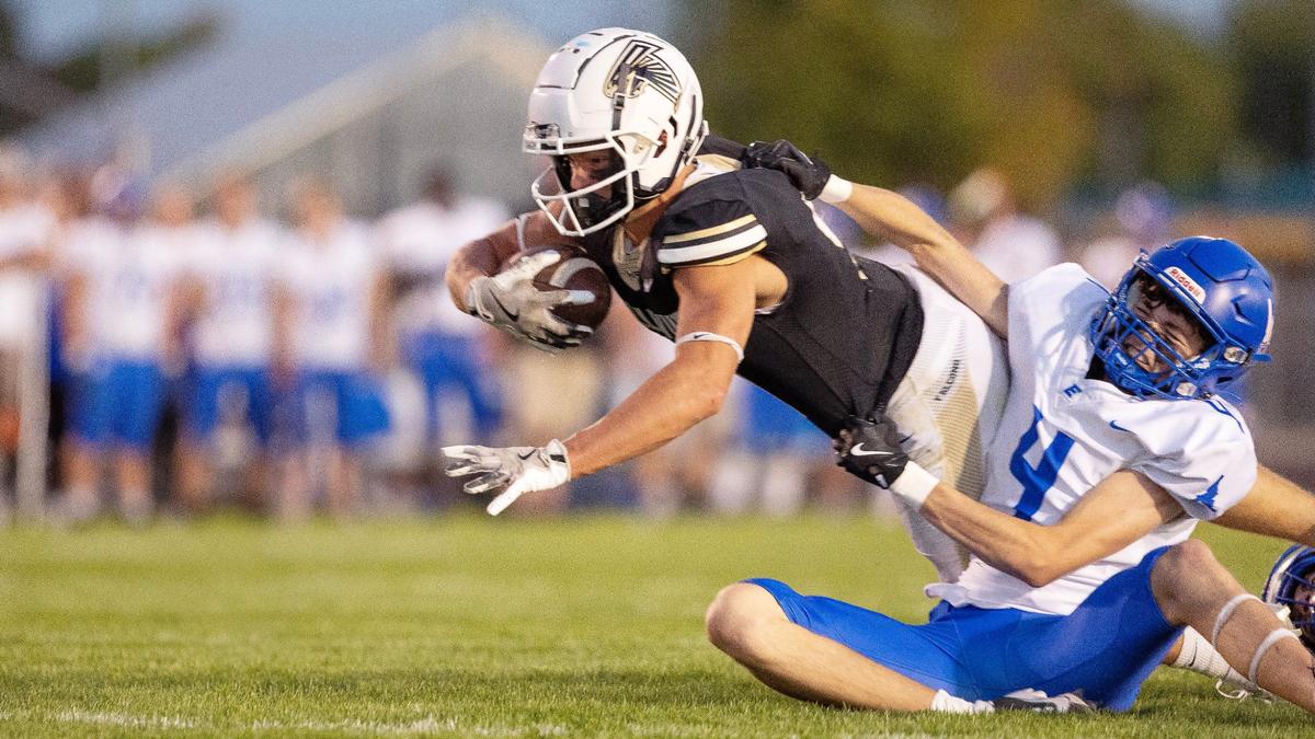 Vallivue running back Onix Carson is tackled by Emmett defensive back Kash Brown in the first half of their game Friday in Caldwell.