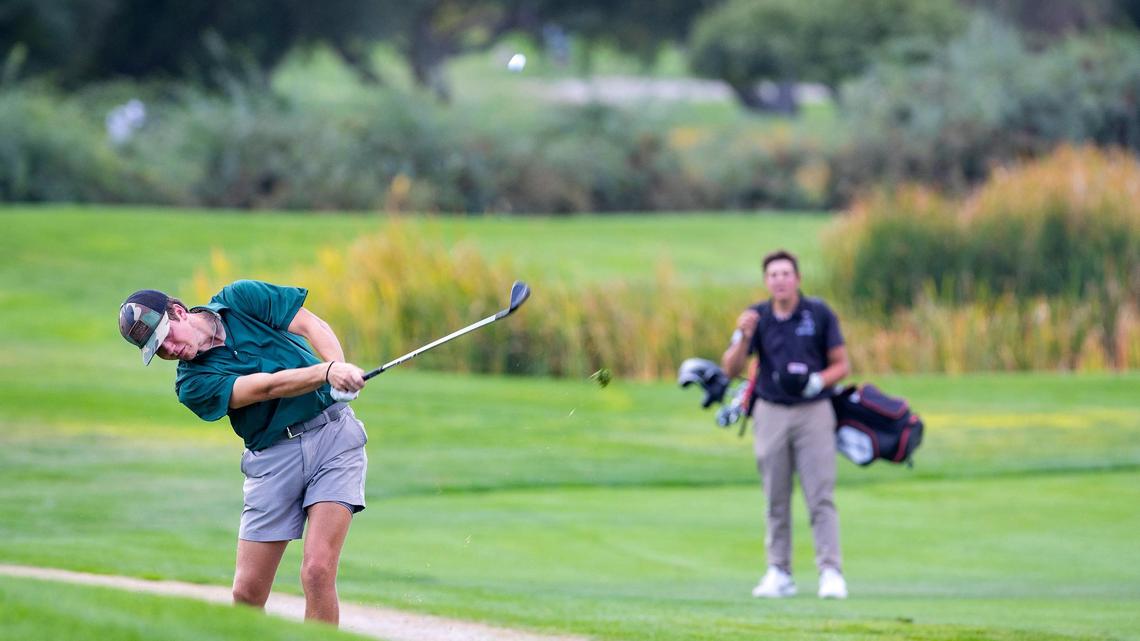 Eagle junior Wheaton Ennis chips onto No. 5 at Quail Hollow Golf Course on Wednesday. Ennis finished second at the 5A District Three Tournament at 3-under 67, leading the Mustangs to the team title.