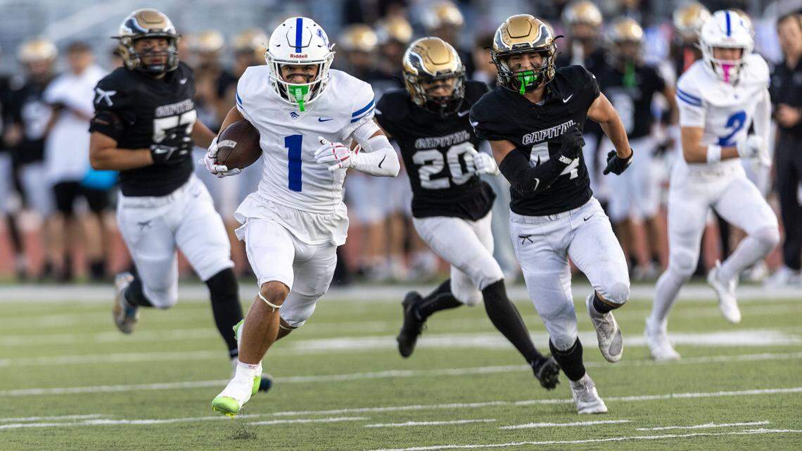 Timberline wide receiver Hudson Lewis stirs up Capital's secondary on his way to a 49-yard touchdown in the first quarter at Dona Larsen Park in Boise, Friday, Sept. 26, 2025.