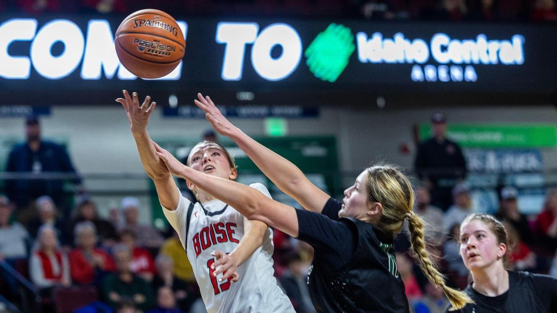 Boise guard Avery Patricco draws a foul on Eagle’s Peyton Wilson for an and-one basket in the 6A District Three championship game Wednesday at the Idaho Central Arena in Boise.