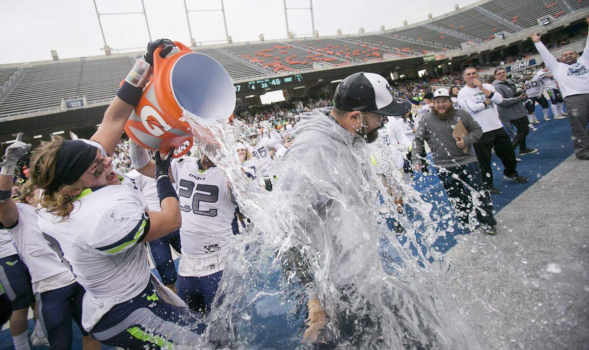 Mountain View football coach Judd Benedick gets doused with water after winning the 2016 state championship.