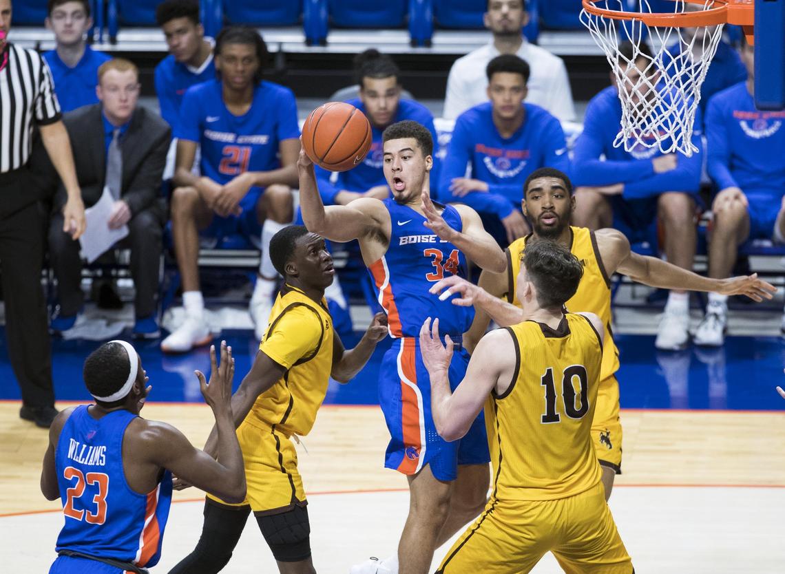 Boise State guard Alex Hobbs passes off to teammate RJ Williams for an assist against Wyoming on Jan. 26. Hobbs leads the Broncos in assists with an average of 3.5 per game.