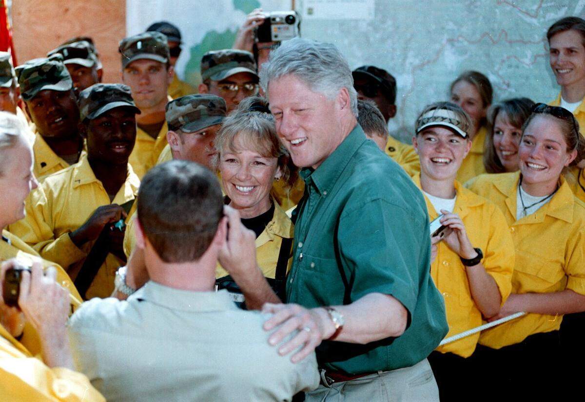 President Bill Clinton poses for pictures with firefighters and crew members at the Burgdorf Junction Fire Incident Command Post north of McCall during a visit to Idaho in 2000.