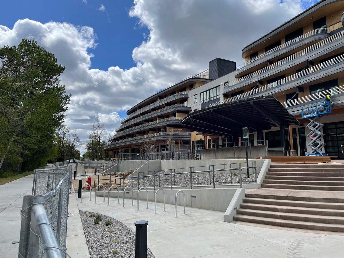 On a recent weekday, workers finish construction on the retail area facing the Boise River Greenbelt.