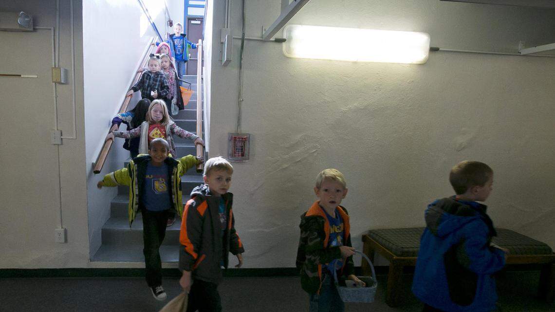 Students at Notus Elementary file into their 90-year-old school’s lower level classrooms in this file photo from Tuesday Nov. 11, 2014. Emmett Superintendent Craig Woods, who was with the Notus school district at the time, testified Monday before the House State Affairs Committee about his experience getting that bond eventually passed on the third try.