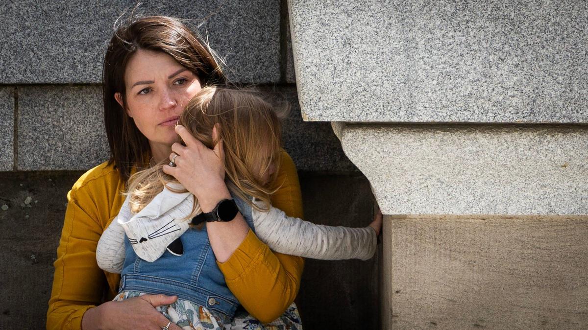 Jillaine St. Michel holds her daughter while attending a rally at the Idaho Statehouse. Doctors found “insurmountable skeletal and organ issues” during her second pregnancy, and the legal issues resulting from strict Idaho abortion laws further complicated the hard decisions they faced.