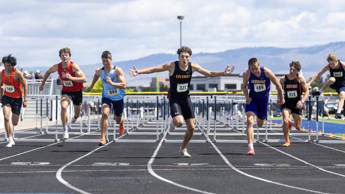 Columbia's Tyson Winkelman, center, takes first place in the boys 5A 110 meter hurdles at the IHSAA 6A/5A Track and Field Championships, Saturday, May 16, 2026 at Mountain View High School.