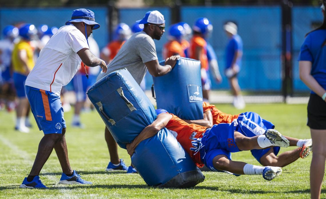 Boise State defensive coaches Gabe Franklin, left, and Jalil Brown at the Broncos’ fall camp Friday, Aug. 2, 2019.