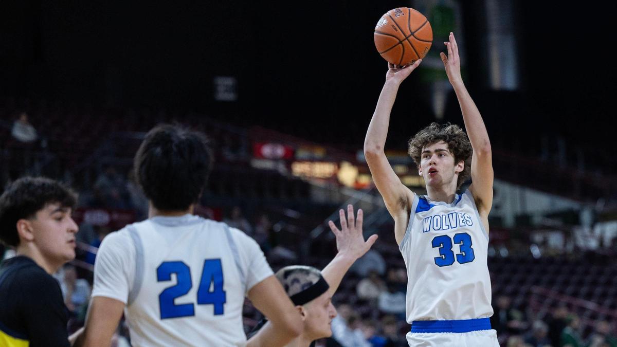 Timberline’s Collin Morris pulls up for one of his five 3-pointers in the first round of the 6A boys basketball state tournament last season. 
