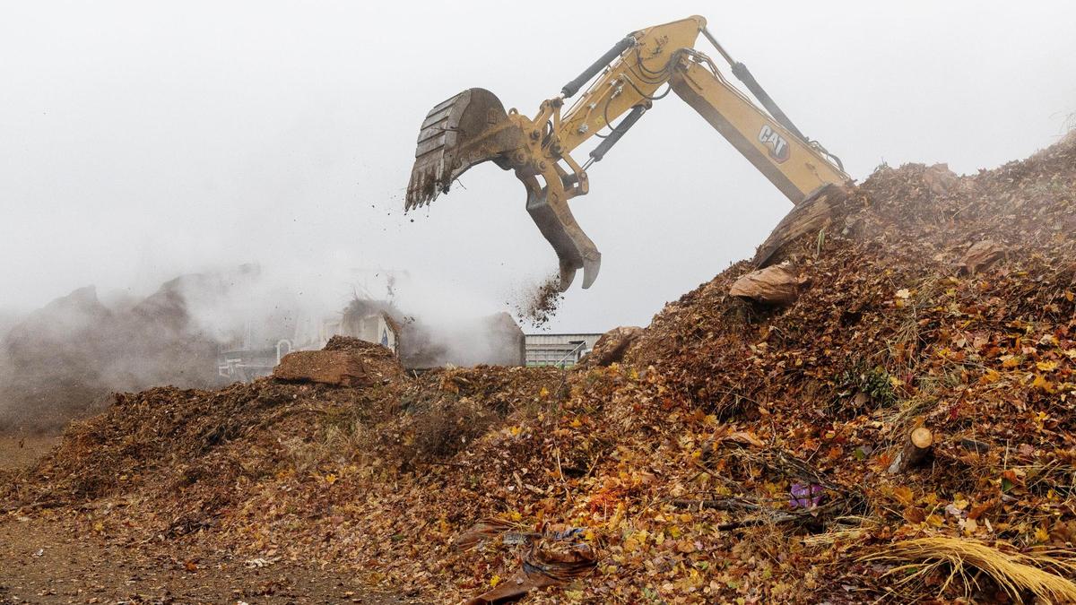 Organic waste is picked up by machinery to be run through a grinder at Timber Creek.