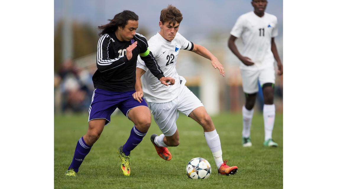 Rocky Mountain senior Kristian Quiros, left, was voted the 5A state player of the year by the classification’s coaches.