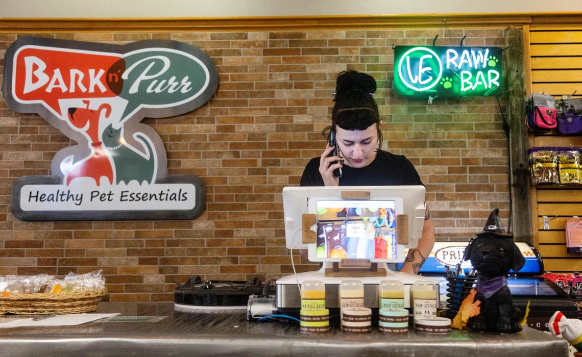 Bark n’ Purr employee Annie Graves speaks with a customer over the phone. Many customers rely on these products, according to the store’s owners.