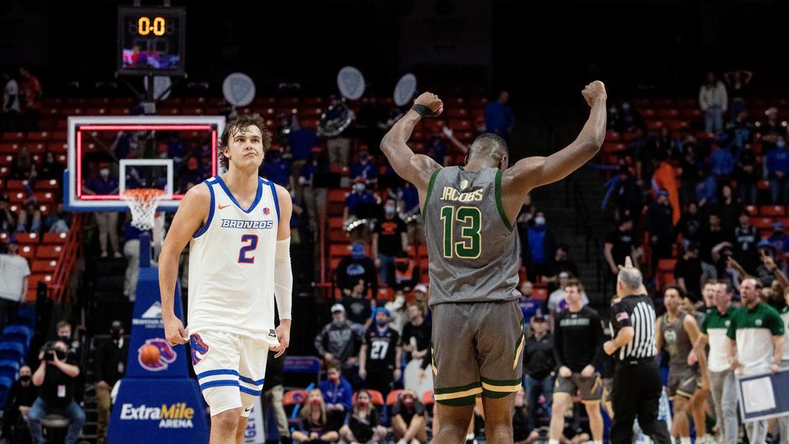 Boise State’s Tyson Degenhart, left, and Colorado State’s Chandler Jacobs react to the Rams winning in overtime on Sunday at ExtraMile Arena.