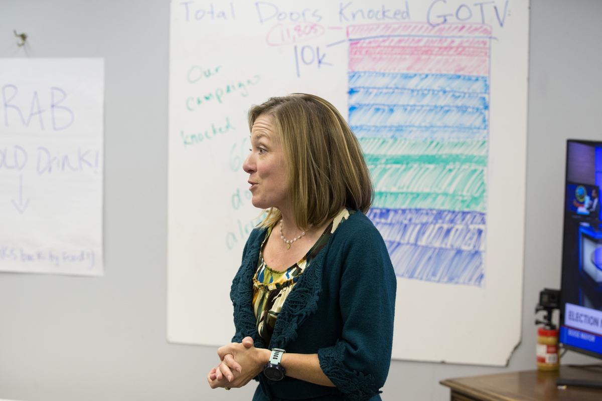 Lauren McLean, talks to volunteers and supporters about the likely runoff election during an election returns watch party at her campaign headquarters.