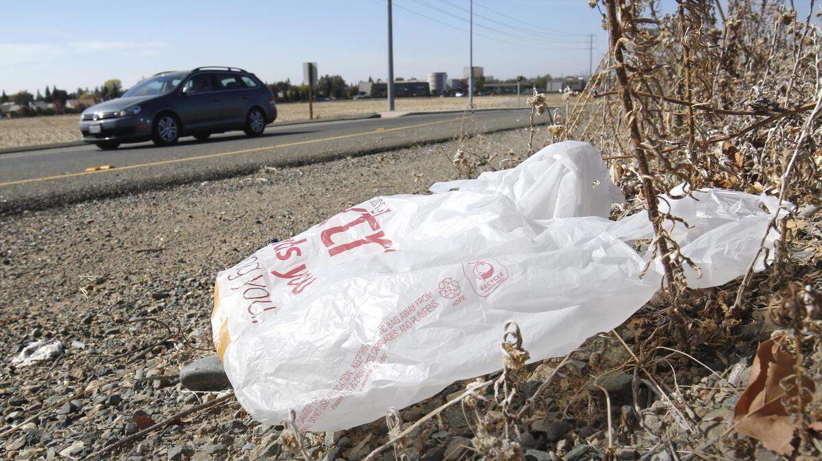 Kroger, the owner of Fred Meyer and other grocery chains, estimates that just 5 percent of plastic bags are recycled annually in America. A plastic shopping bag litters a roadside in Sacramento, California.
