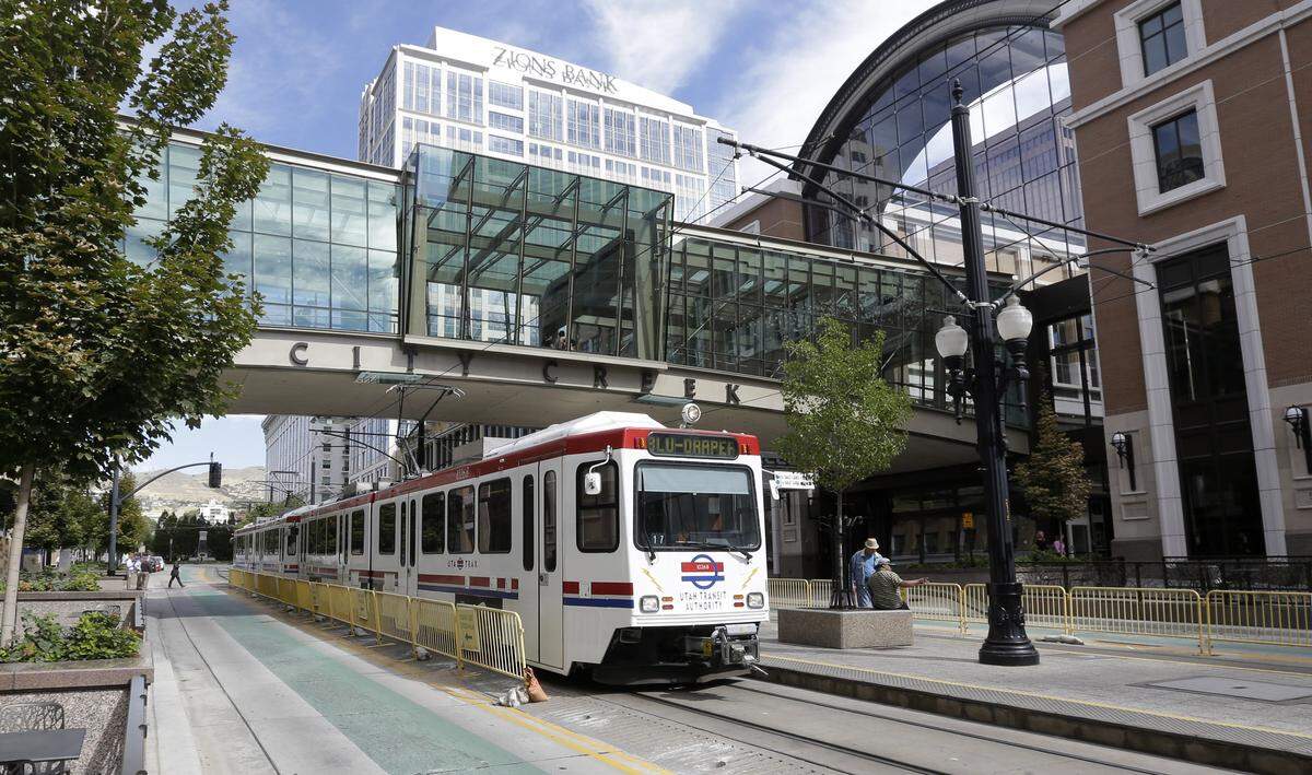A Utah Transit Authority Trax light-rail train pulls into its stop in front of the City Creek shopping center in Salt Lake City. Boise Mayor David Bieter has proposed a light-rail train circulating through Downtown from east to west, with an extension south to Boise State University. But the city lacks money to build it. Building a light-rail line along I-84 also has been studied.