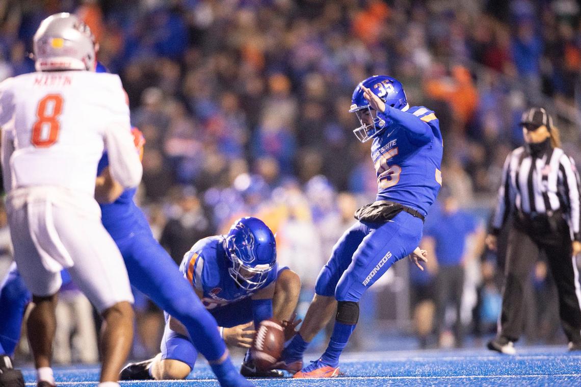 Boise State kicker Jonah Dalmas kicks an extra point during the first half Saturday at Albertsons Stadium. Dalmas matched a program record with 25 made field goals this season.