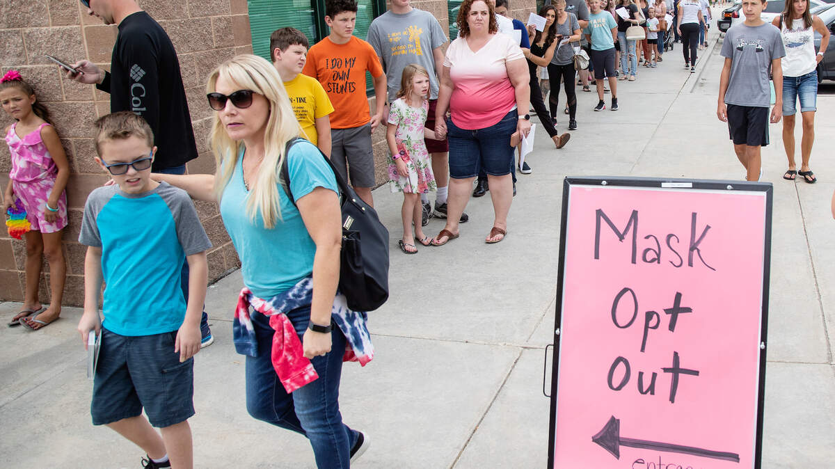 Parents in the West Ada School District line up around the administration building on Aug. 25 to opt their children out of complying with a face mask rule in the schools. It’s no longer an option to opt out, as a hard mandate is now in place.