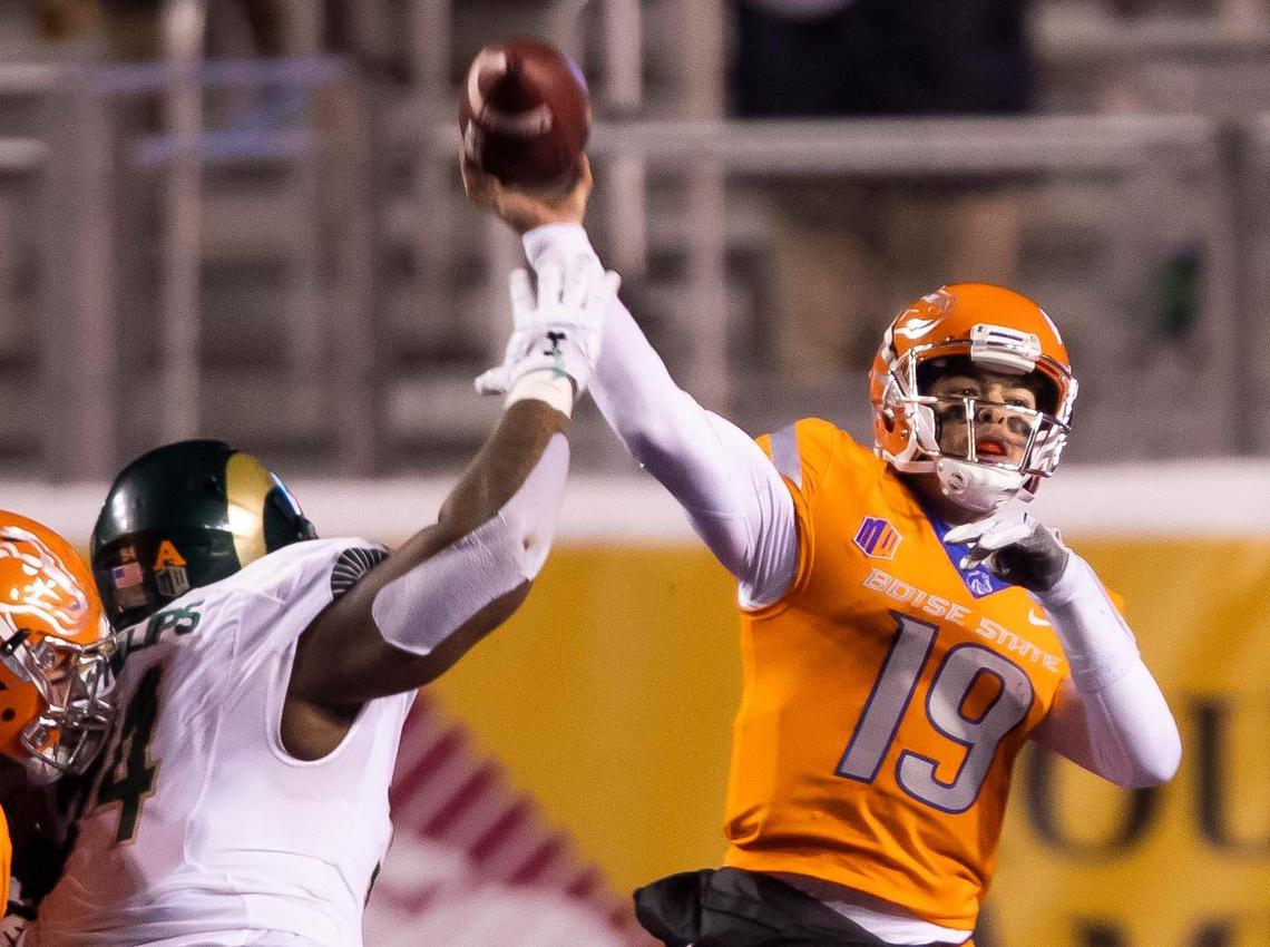 Boise State quarterback Hank Bachmeier gets a pass off under pressure from Colorado State defensive lineman Devin Phillips on Thursday at Albertsons Stadium.