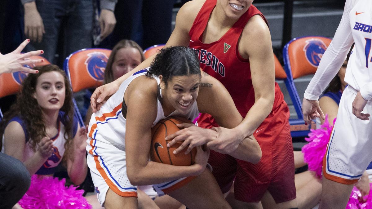 Boise State’s Joyce Harrell is intentionally fouled by Fresno’s Candice White in the final minutes of the game when Fresno came within two points of BSU. Boise State won 83-76.