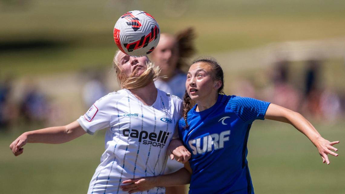 Idaho Rush’s Sarah Colwell, left, fights for control for the ball in the U-15 girls Far West Regional quarterfinals against Utah Surf on Friday at the Simplot Sports Complex in East Boise.