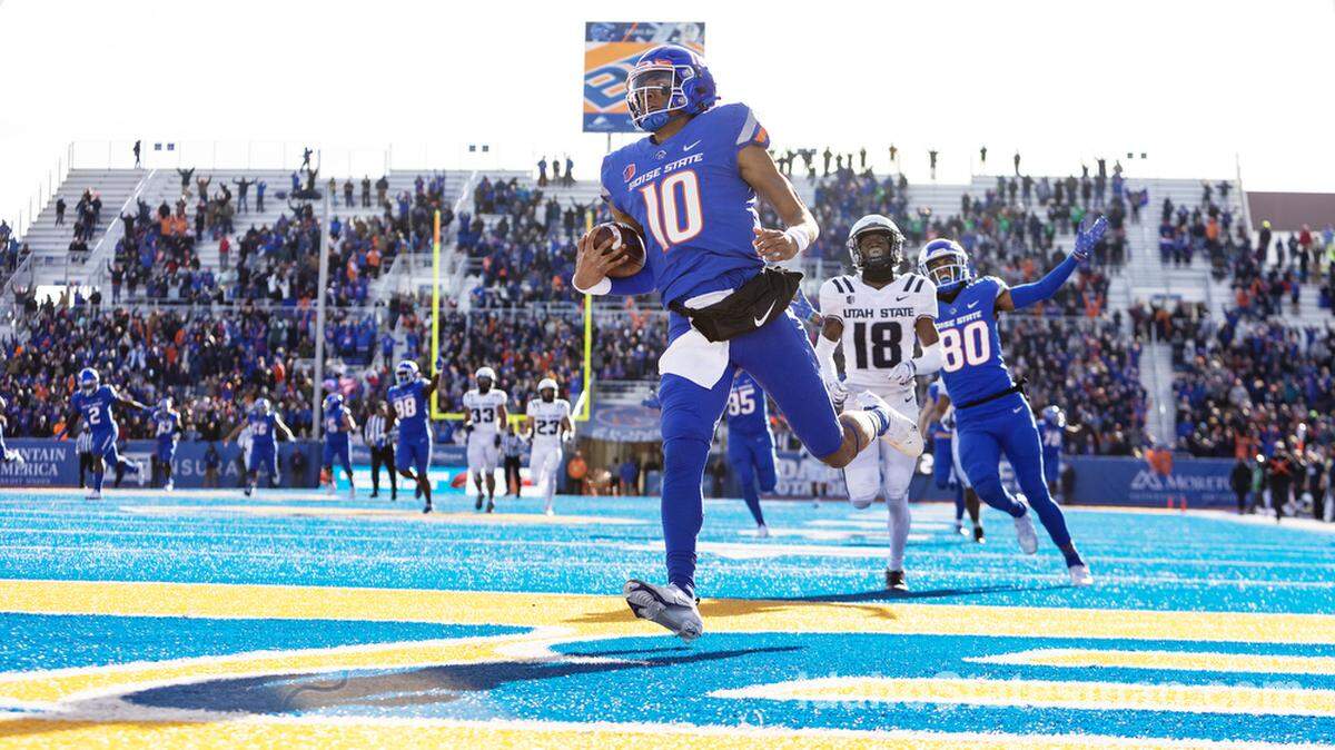 Boise State quarterback Taylen Green makes a 91-yard touchdown run in the fourth quarter of their football game against Utah State at Albertsons Stadium on Friday, Nov. 25, 2022.