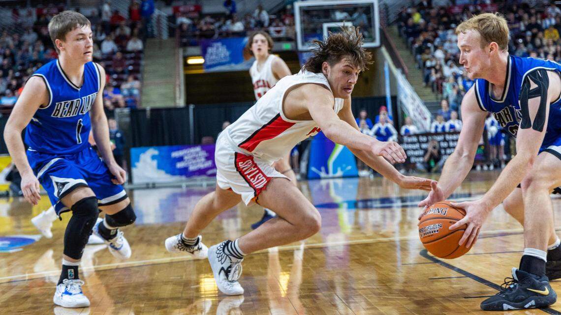 Melba’s Cache Beus loses the ball to Bear Lake’s Keaton Carlsen on Saturday at the Ford Idaho Center.