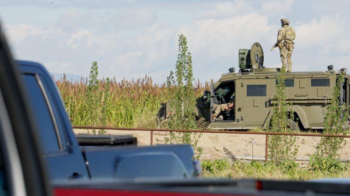 A member of the FBI’s SWAT team stands on top of an armored vehicle during a raid at La Catedral Arena in Wilder that resulted in the arrest of five people on criminal charges and dozens of others on immigration violations. The FBI-led the operation after a months long investigation into allegations of illegal gambling.