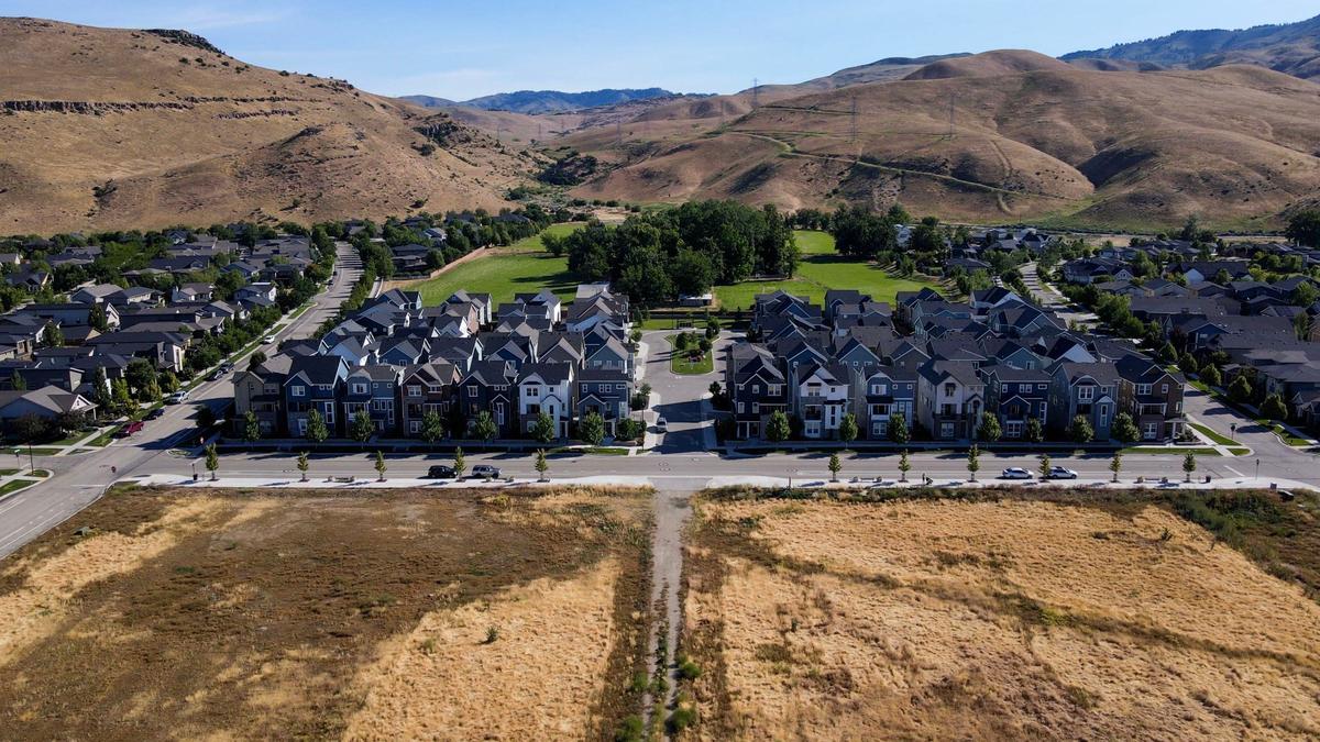 The village green and town center development would culminate at Wolf Tree Street on the north end, shown in this north-facing aerial in center.