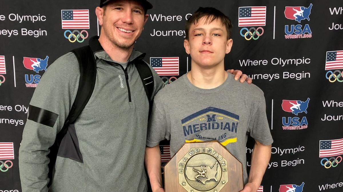 Meridian High freshman Jason Mara poses with his national championship trophy after winning the 126-pound title at the 16-and-under USA Wrestling Folkstyle Nationals tournament earlier this month.