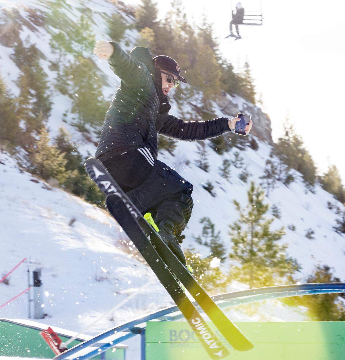 Nick Hansen of Boise gets air with his skis at Bogus Basin on Nov. 27, 2021. With the help of manmade snow, Bogus Basin ski facilities opened to eligible season pass holders for Nov. 25-28. They plan to reopen on Saturday, Dec. 4, for daily winter season operations.