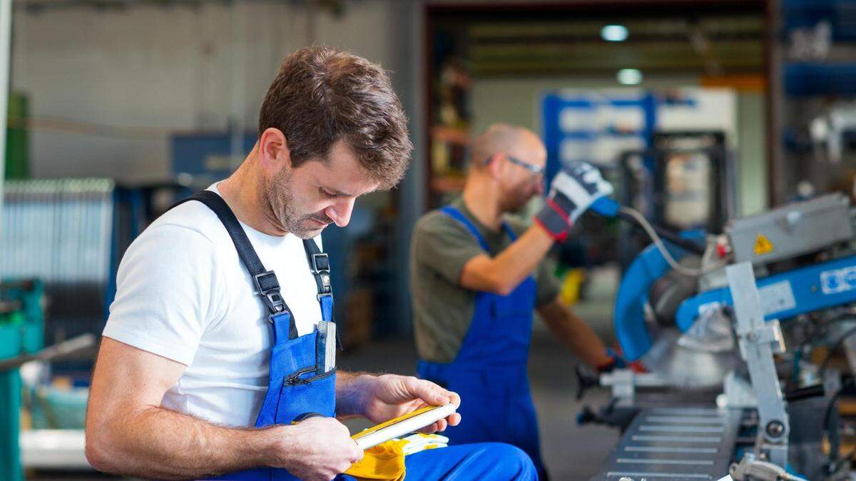 Factory workers are shown in this file photo.