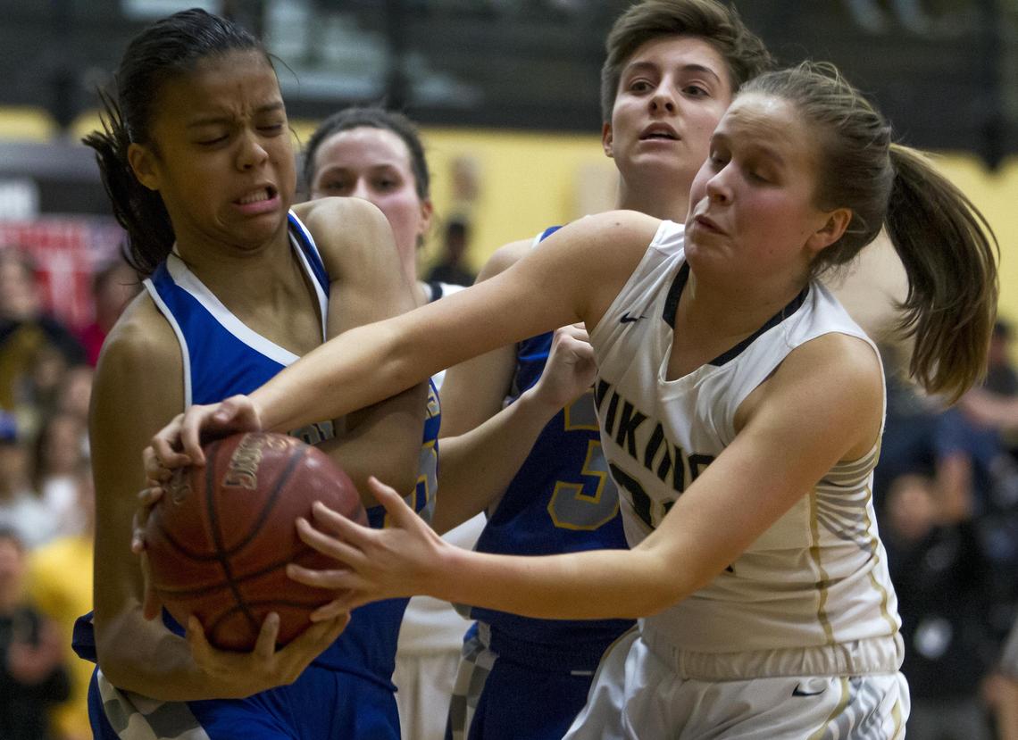 Caldwell center Aaliyah Kennedy fights for a rebound with MIddleton’s Emalie Wood in the 4A District Three championship game last week.